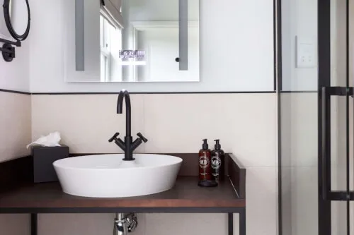 Contemporary bathroom with a stylish sink and toiletries at Roxburghe Hotel Golf & Spa.