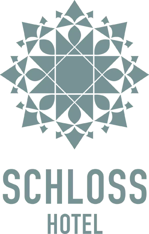 Schloss Hotel logo symbolizing luxury accommodation.