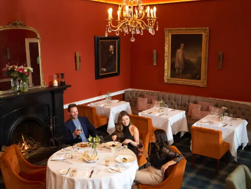 Dining area in Roxburghe Hotel Golf & Spa with guests enjoying their meal.